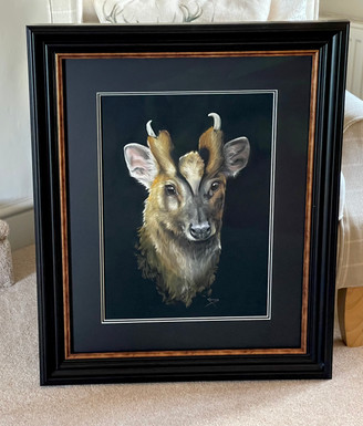 Original artwork in a black and bronze frame