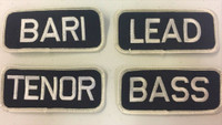 These simply designed patches are ideal for letting people know what part you sing. 

Tenor, Bass, Baritone, Lead...maybe all four!

They can be used on bags, jackets, shirts.

Easily applied with low heat. Use an iron and wax paper to affix your patch to almost any type of clothing.

Perfect for our Mechanic shirts.