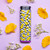 A unique refillable torch lighter with an all around print of a distorted checkerboard with yellow distorted smiley faces.