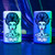 A set of two purple and green Bride of Frankenstein-themed flip torch lighters, featuring the iconic brides hairstyle and a spooky yet stylish design. The lighters come in a beautiful matching metal tin.