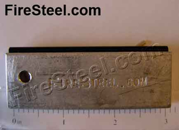 A slab of pure magnesium to which a FireSteel.com FireSteel is attached.  Fire and tinder in one package.