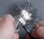 Scrape the FireSteel toward the pile of magnesium shavings you have created - which will catch on fire and burn at thousands of degrees F, helping you to start a fire even with damp wood.