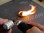 FireSteel Tube in action starting a cotton ball on fire