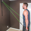 Male performing upper body exercises using elastic tubing resistance bands with the Space Saver Gym