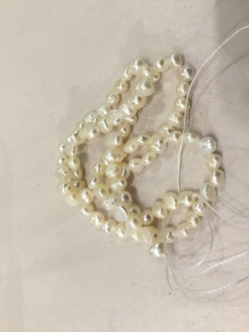 Small white pearl strand 