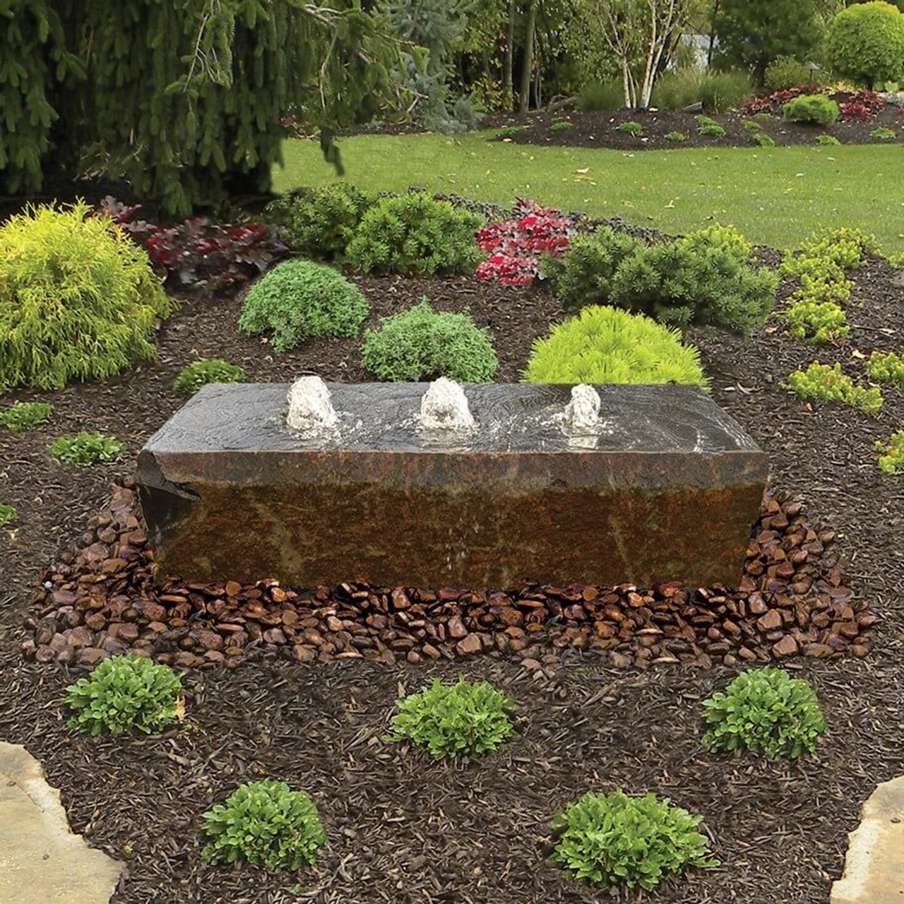 Left, right and center. The best things come in threes! The Triad Fountain features a low-profile design with a polished top, natural sides and chiseled ends. Each hole may be plumbed separately so you can adjust the waterflow in each one for a variety of looks. The Triad is 48″ long, 24″ wide and 12″ tall. Three core drilled holes are ready for plumbing and a light ring. Too large for a standard basin, these large basalts work best with an offset reservoir system.
