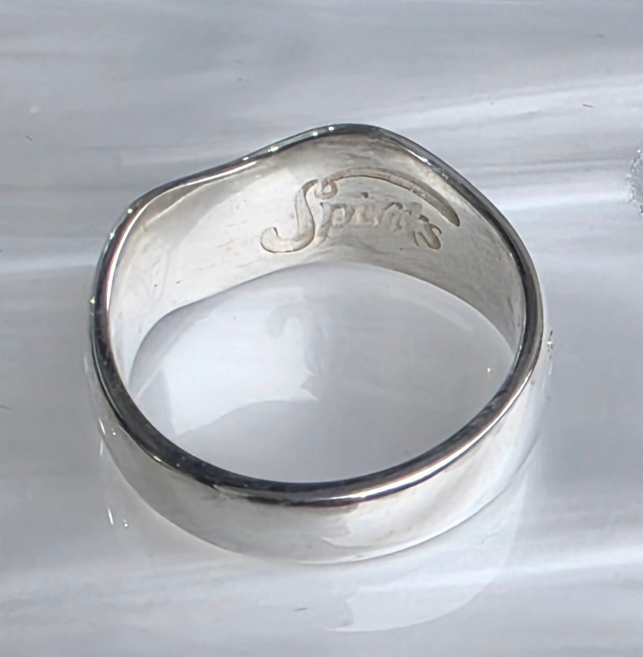 complimentary spirits logo is on all inside of rings