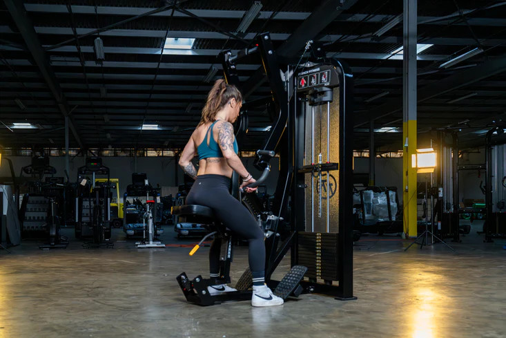 Woman using gym machine