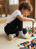 Bee Happy Alpaca Kids Grippy Socks, lifestyle on boy playing lego