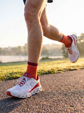 Second Skin Ultralite™  Alpaca Running Socks in megawatt orange on runner outside
