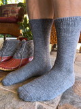 Outdoor Terry Lined Alpaca Crew Socks on Legs with Boots.
