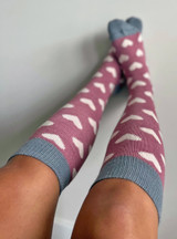 Warrior Alpaca & Bamboo Socks Heart Murmur on woman's feet fun and playful.