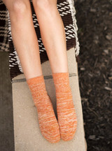 Marled Best Friend Alpaca Wool Socks - Hand Cranked
Ankle High Golden Aura on legs with blanket.