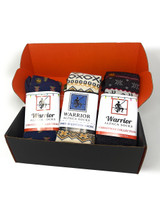 All three Christmas alpaca socks side by side on the foot forms