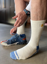 High-Performance Sport Alpaca Crew Socks in White / Blue on Model.