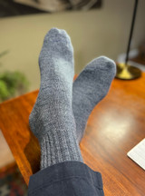 Cozy, Unisex Warrior Alpaca Ribbed Dress Socks on Man's feet.