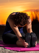 Non Skid "Yoga & More" Alpaca Socks on woman doing yoga on mat.