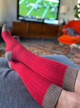 Long John Colorblock Alpaca Boot Socks red / brown on model watching football.