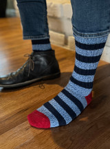 Model putting on Old School Athletic Stripe Alpaca Crew Socks