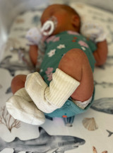 Warrior Alpaca Socks on Newborn Infant - Baby is 4 days old.