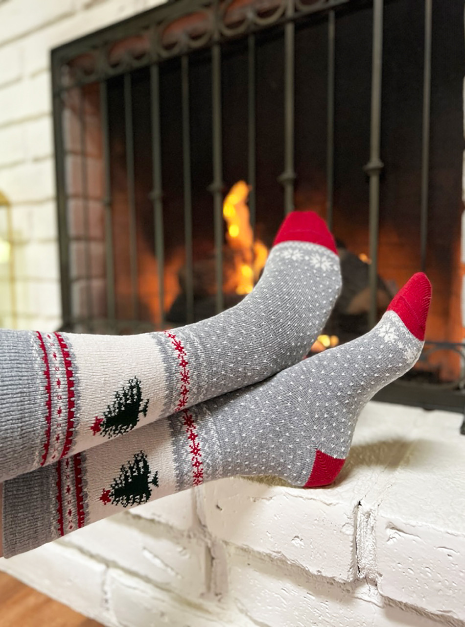 Warrior Alpaca Socks Rockwell Holiday Novelty Socks on feet by warm cozy fire.