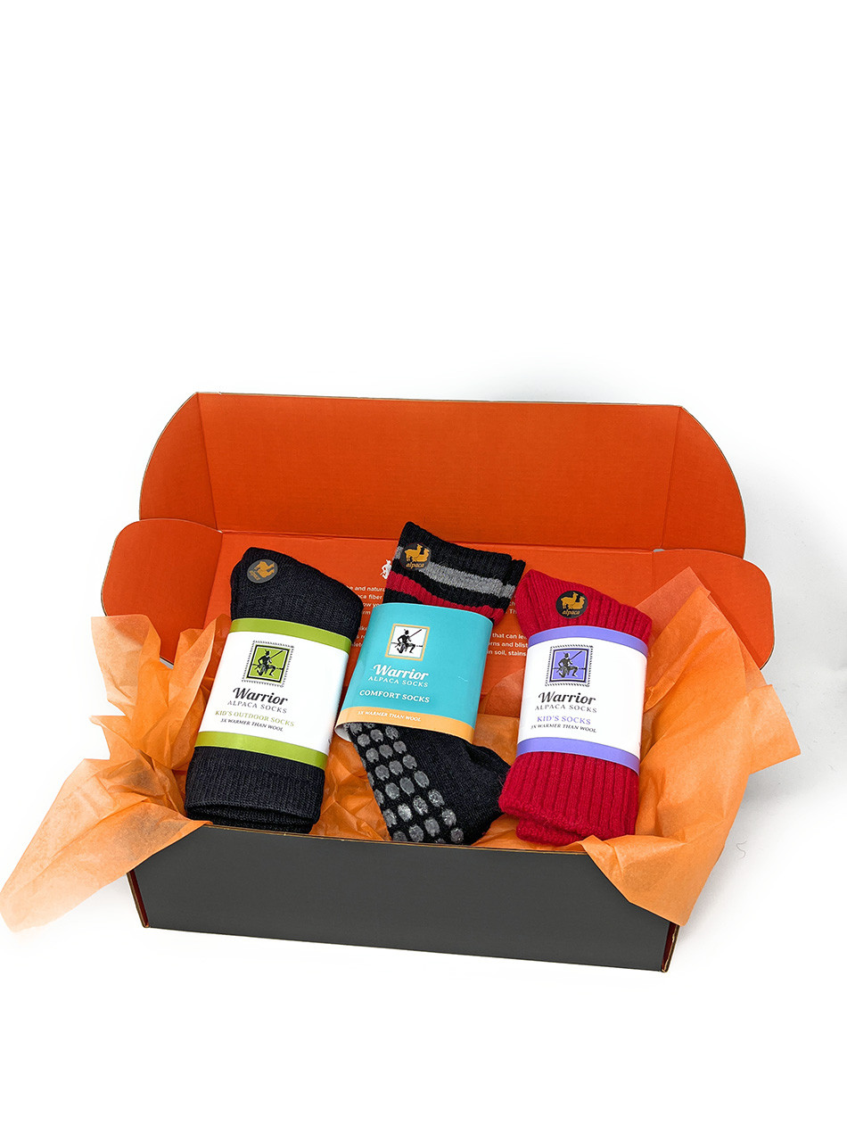 Krampus Sock Box with three pairs of alpaca socks for kids displayed in a gift box