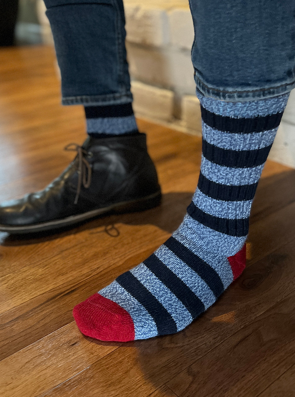 Model putting on Rugby Stripe  Alpaca Crew Socks