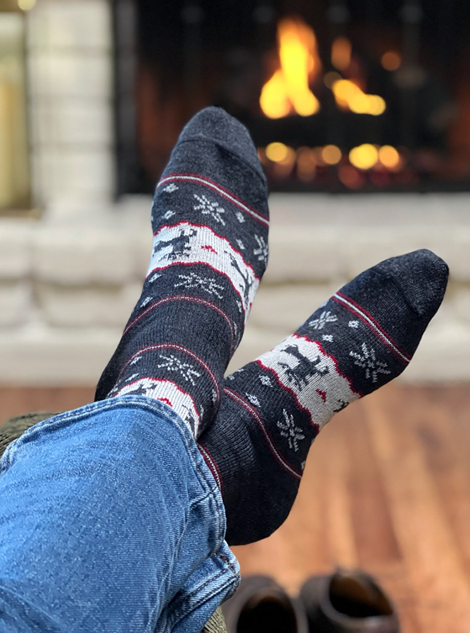 Nordic Reindeer Fair Isle Alpaca Wool Socks in front of fire.