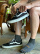 Man putting on  Breakaway Sport Alpaca Quarter-Crew Socks