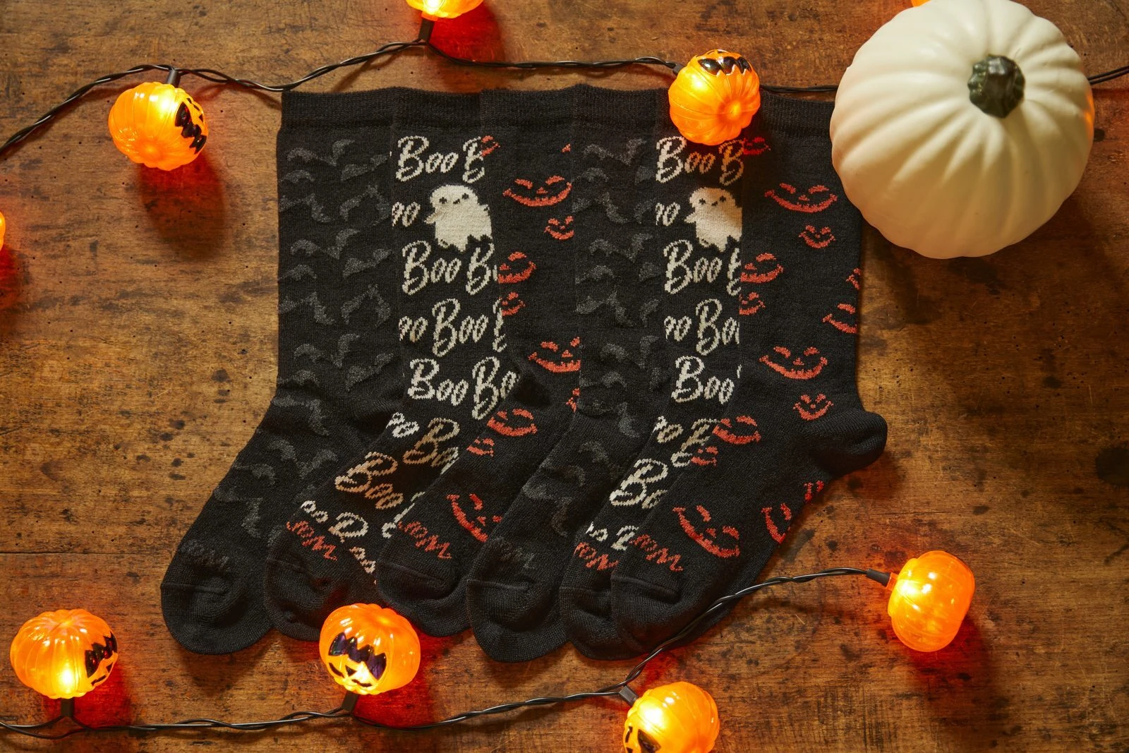 Warrior Halloween alpaca socks with jack-o'-lantern lights and a white pumpkin