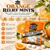 Tillmans orange CBG mints pouch on an outdoor table with loose mints