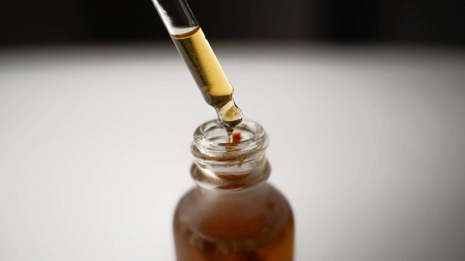Dropper Extracting From Bottle of Cannabis Tincture