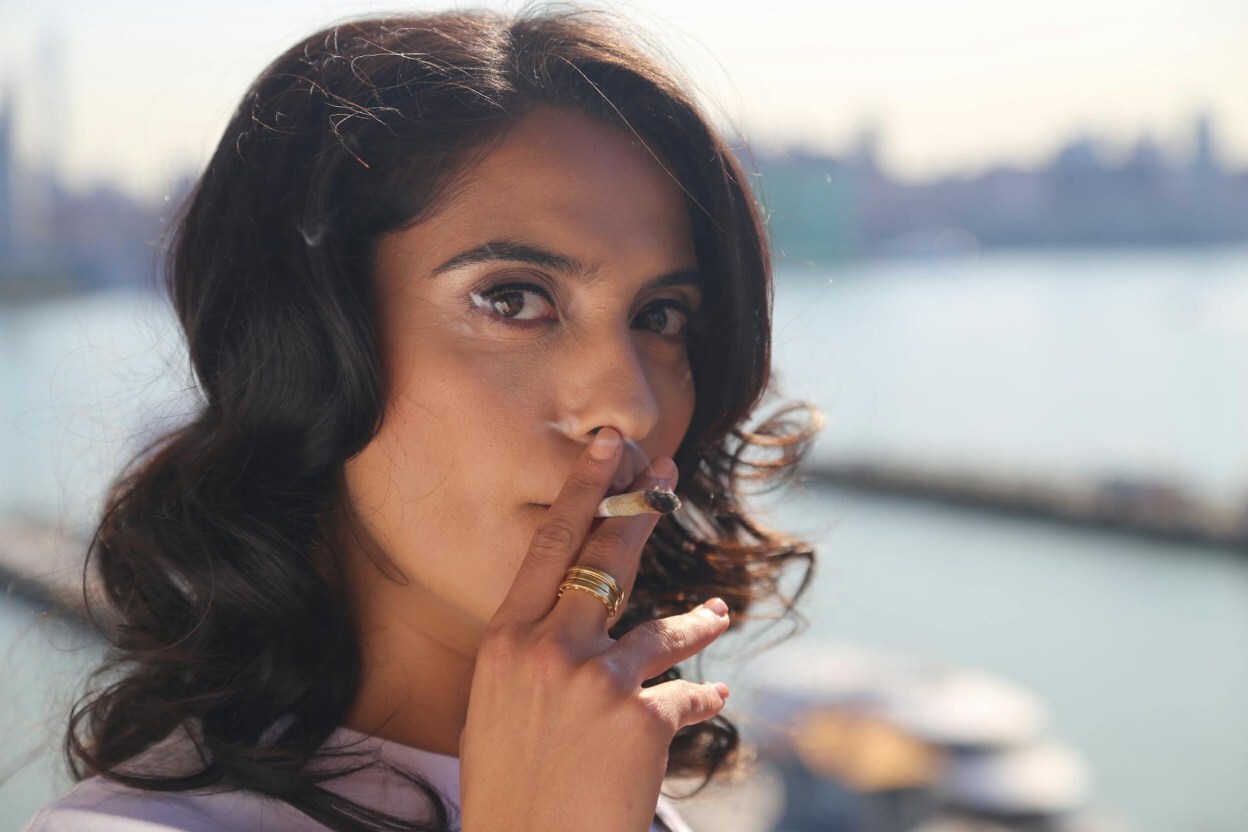 A woman smoking a joint in New York City