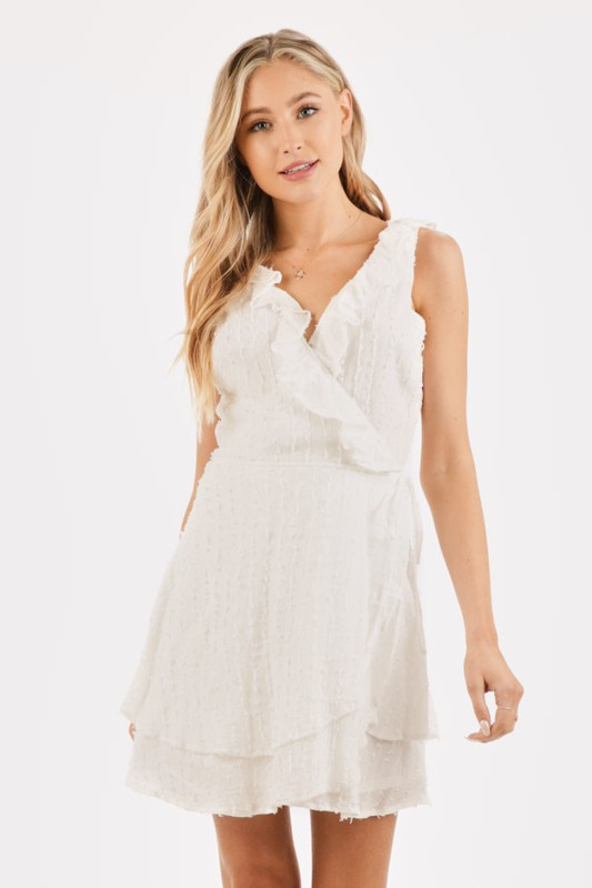 white sleeveless wrap dress