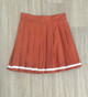 burnt orange pleated skirt