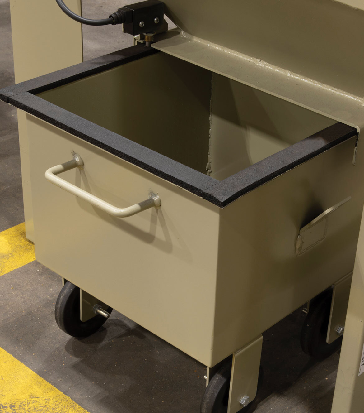 Tan colored dust container with handle