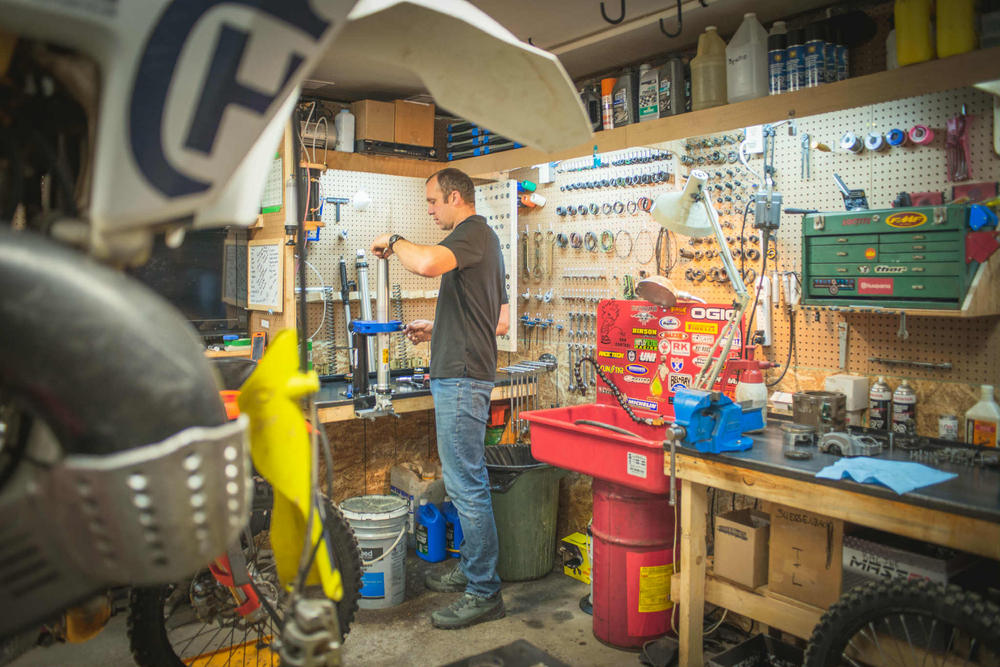 A technician working at a bench in the TrueTech shop