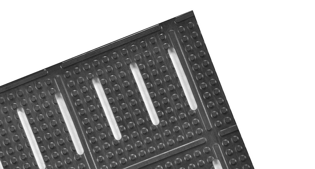 Wide slots combined with a knobbed top for better foot traction and fluid drainage Wide slots combined with a knobbed top for better foot traction and fluid drainage