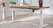 UPLIFT Magnetic Cable Channel shown organizing a cable under standing desk with white frame and solid wood desktop