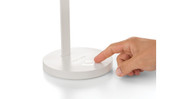 You can control the lamp's dimming and color adjustments from touch pads on the base.