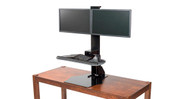 The UPLIFT Adapt Pogo Standing Desk Converter locks in place when the adjustment button is released