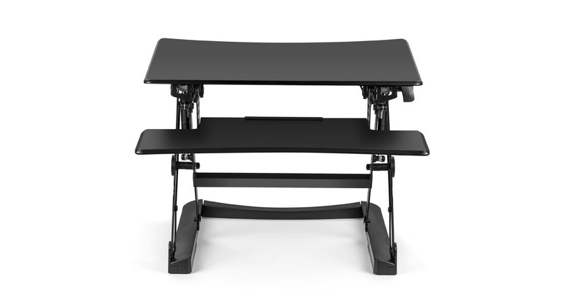 The Lift Standing Desk Converter by UPLIFT Desk converts fixed-height spaces into height-adjustable workstations