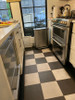Classic Pattern 7 Checkered Past - (distressed) - vinyl floor cloth 32x96 runner used in a kitchen 