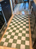 Classic Pattern 7 Check Please (distressed)- vinyl floor cloth runner used in a kitchen 