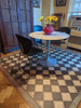 Classic Pattern 9 Checkmate - vinyl floor cloth used in a dining area