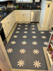 Spicher vintage vinyl floor cloth Kibbutz, custom cut T-shape in a kitchen.