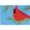 Cardinal perched in pine