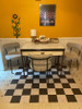 Classic Pattern 7 Checkered Past (lightly distressed) vinyl floor cloth 60x60 used in a kitchen 