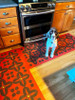 Classic Pattern 3 Red Rum (lightly distressed) - vinyl floor cloth Murray modeling his new flooring in a kitchen 