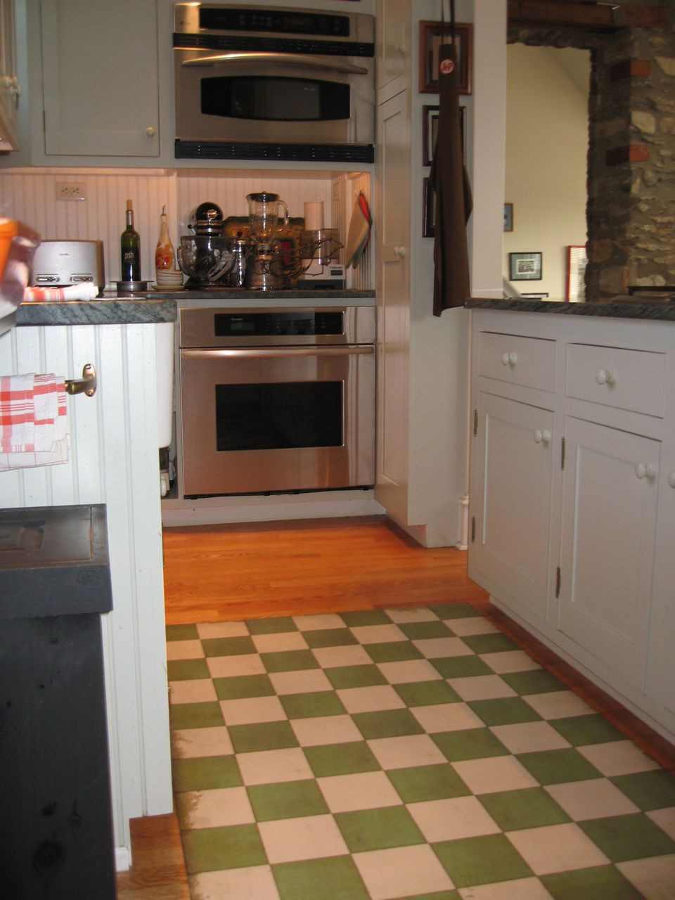 Classic Pattern 7 Check Please (distressed)- vinyl floor cloth used in a kitchen 
